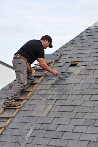 Man patching a roof